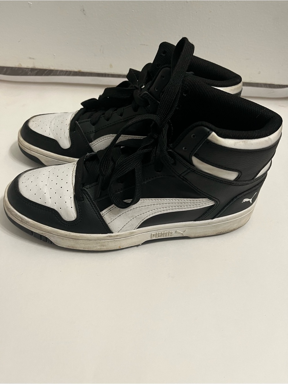 Puma Black and White Mid-Top Sneakers